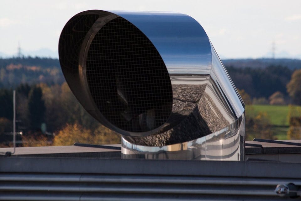 A large air unit exhaust vent is shown on the exterior of a building.