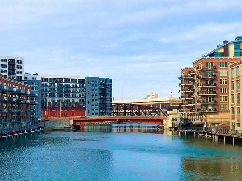 The Milwaukee, Wisconsin skyline rises along the Milwaukee River.