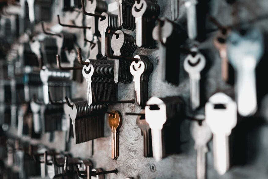 Hundreds of keys hang on a wall. A good property management company will have a solid building key policy.