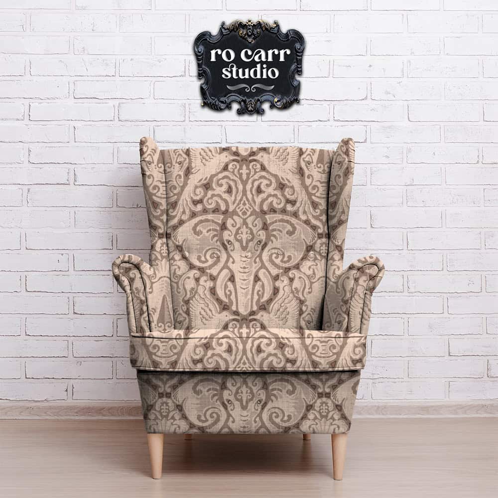 Kalahari Safari pattern shown as upholstery on traditional wing-backed chair.