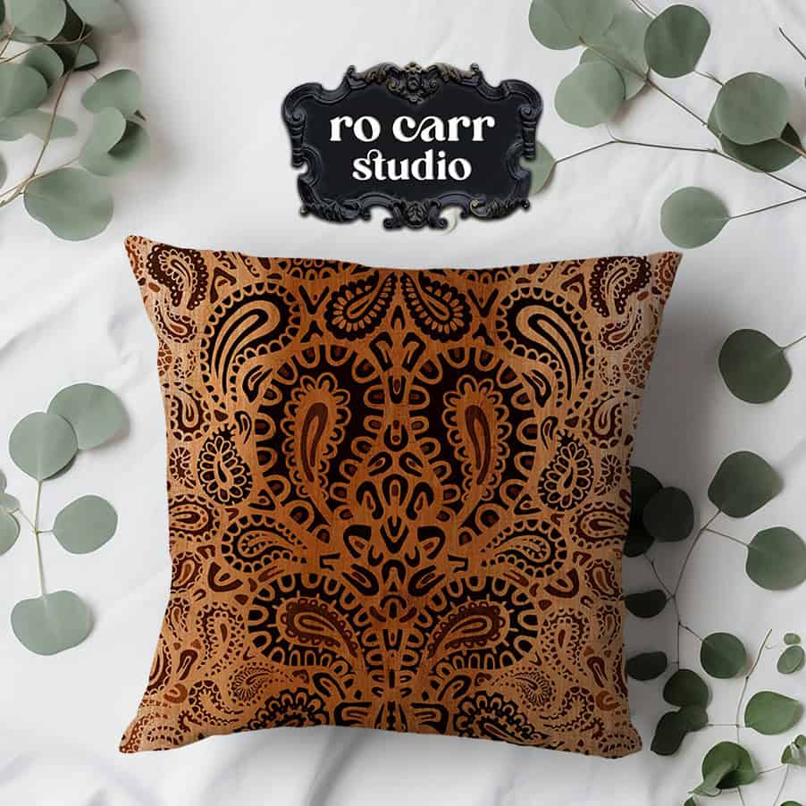 Leopard paisley pattern printed on a decorative throw pillow.