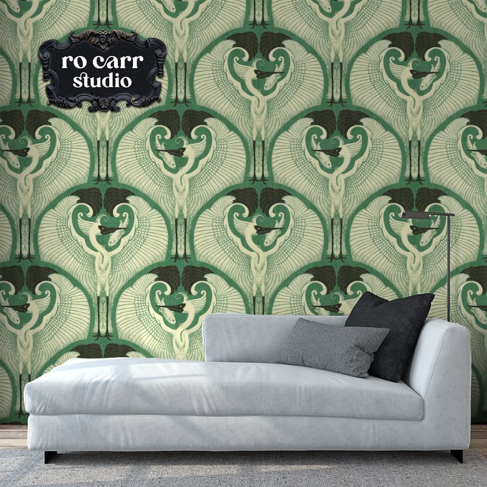 Mockup of art deco egret pattern in jade green, shown as wallpaper behind a chaise lounge.