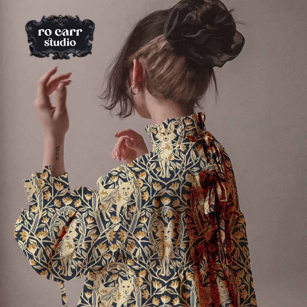 Mockup of blouse printed with the hunt club fabric, worn by a stylish young woman seen from the back.
