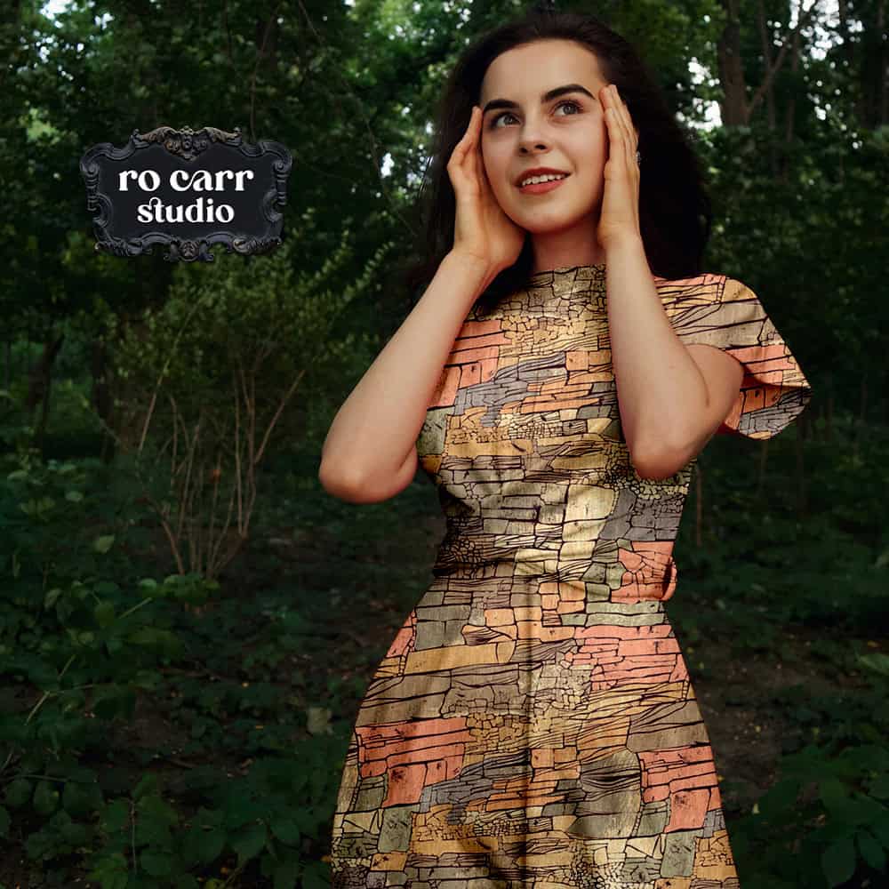Mockup of a woman wearing a dress with short sleeves, made of flowing fabric printed with the Rock Candy Mountain pattern.