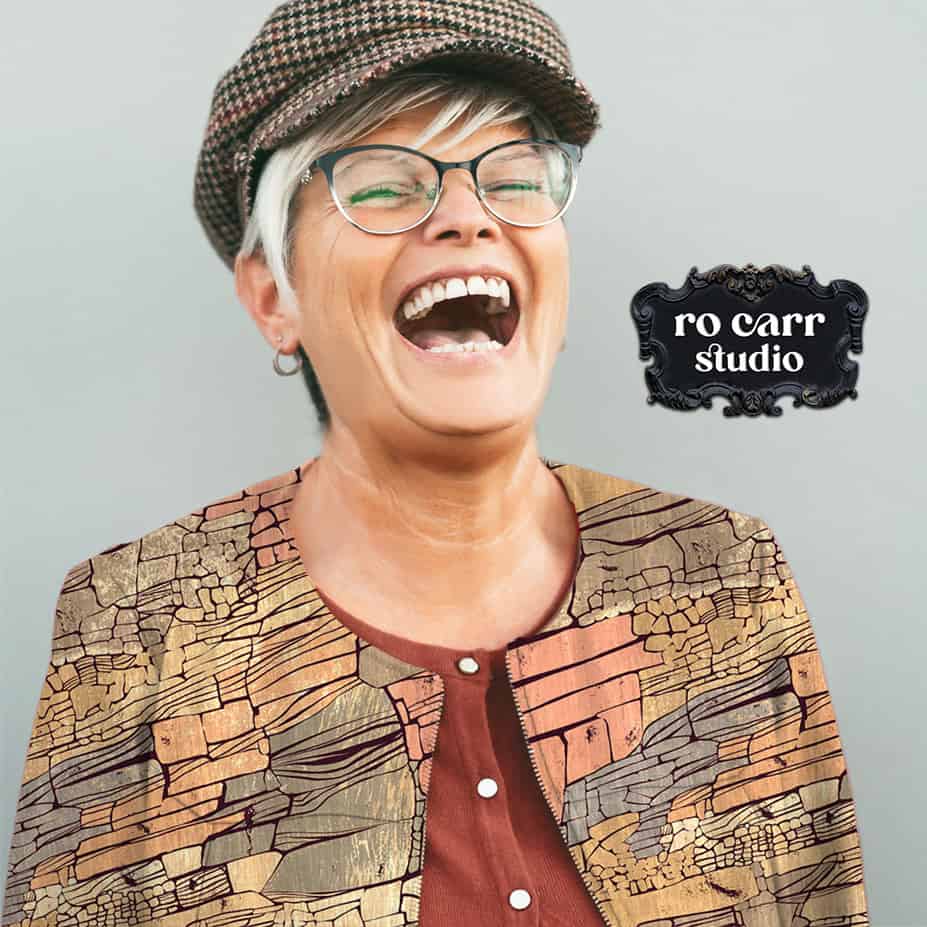 Mockup of a woman with a big laugh, wearing a collarless jacket printed with the Rock Candy Mountain pattern.