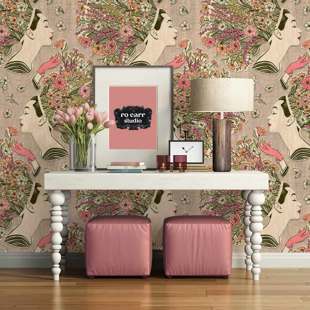 Foyer table and ornaments against wildflower collage wallpaper.