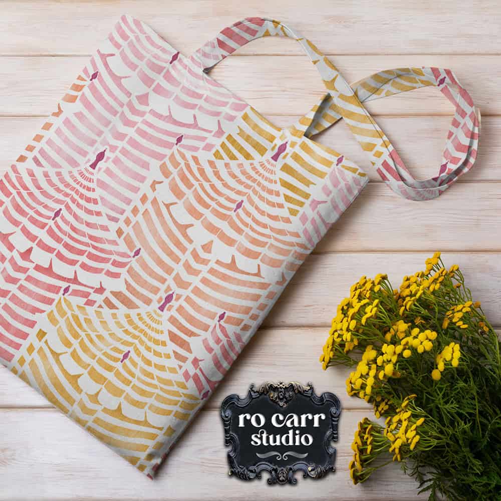 Cabana Republic fabric folded as a tote bag alongside yellow wildflowers on a wooden surface.