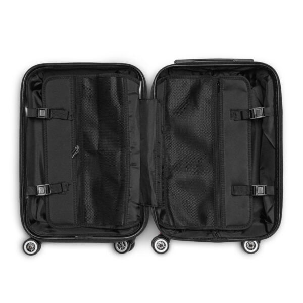 Interior of Heirloom & Bloom hard-shell suitcase, open to show mesh pockets, compression straps, and lining.