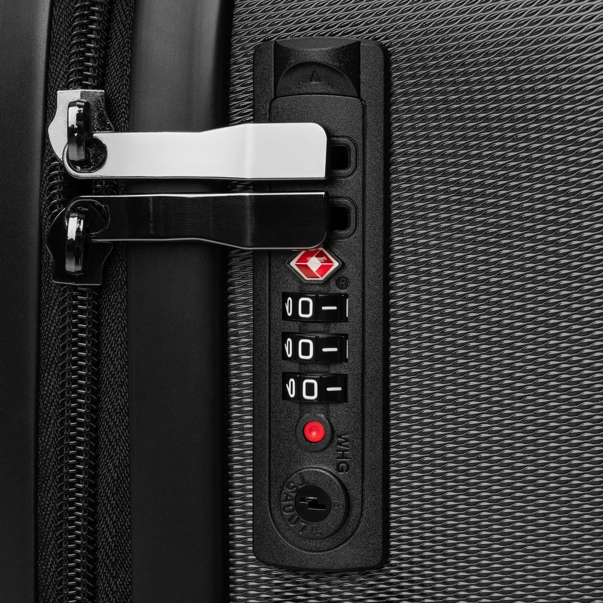 Close-up of TSA-approved combination lock and zipper pulls on suitcase.