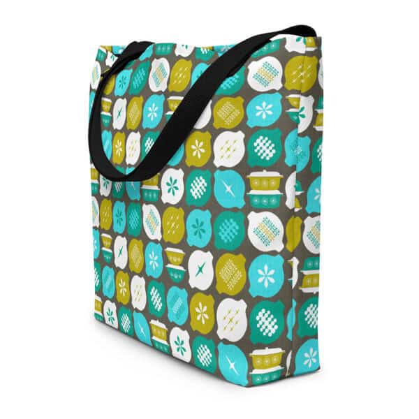 Hostess with the Mostest tote bag, in retro aqua and avocado on gray background, shown standing in three quarter view.
