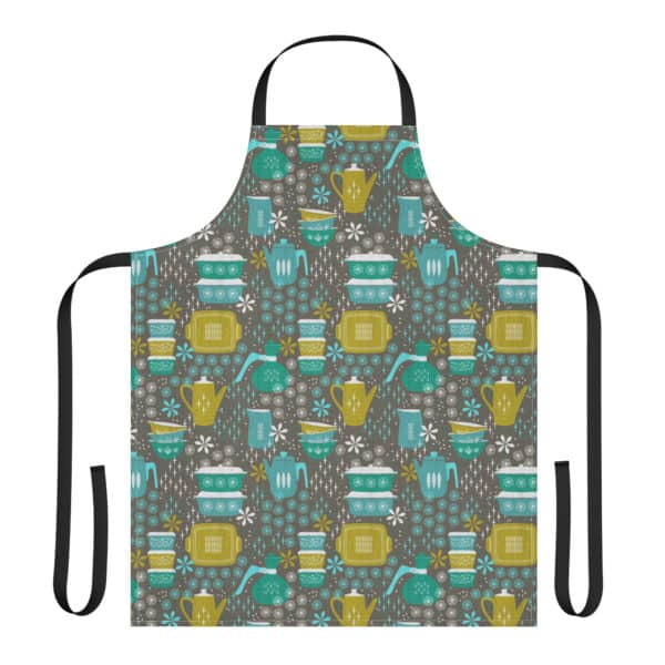 Apron with black straps printed with Hostess with the Mostest pattern featuring retro pyrex dishes in aqua and avocado on a gray bacgkround.