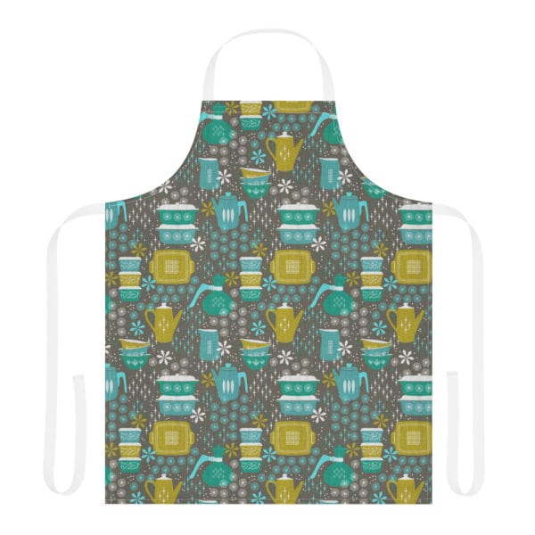 Apron with white straps printed with Hostess with the Mostest pattern featuring retro pyrex dishes in aqua and avocado on a gray bacgkround.