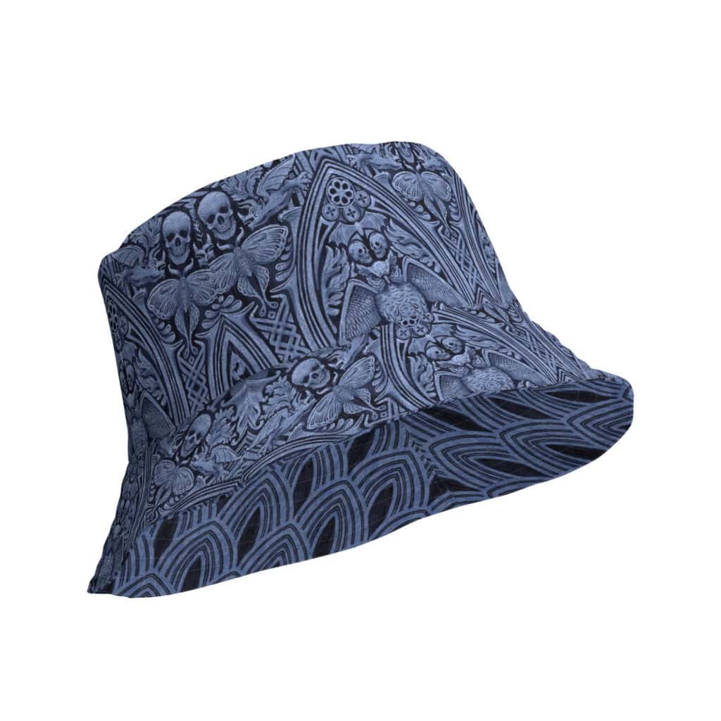The Grande Macabre Reversible Bucket Hat in Twilight Blue, showing gothic cathedral pattern with skulls, moths, and owls.