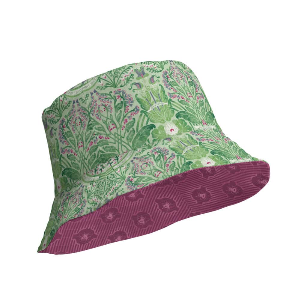 Reversible bucket hat shown with vibrant green Rennie's Field Journal floral print on outside, and interior contrasting print peeking out from the inside.
