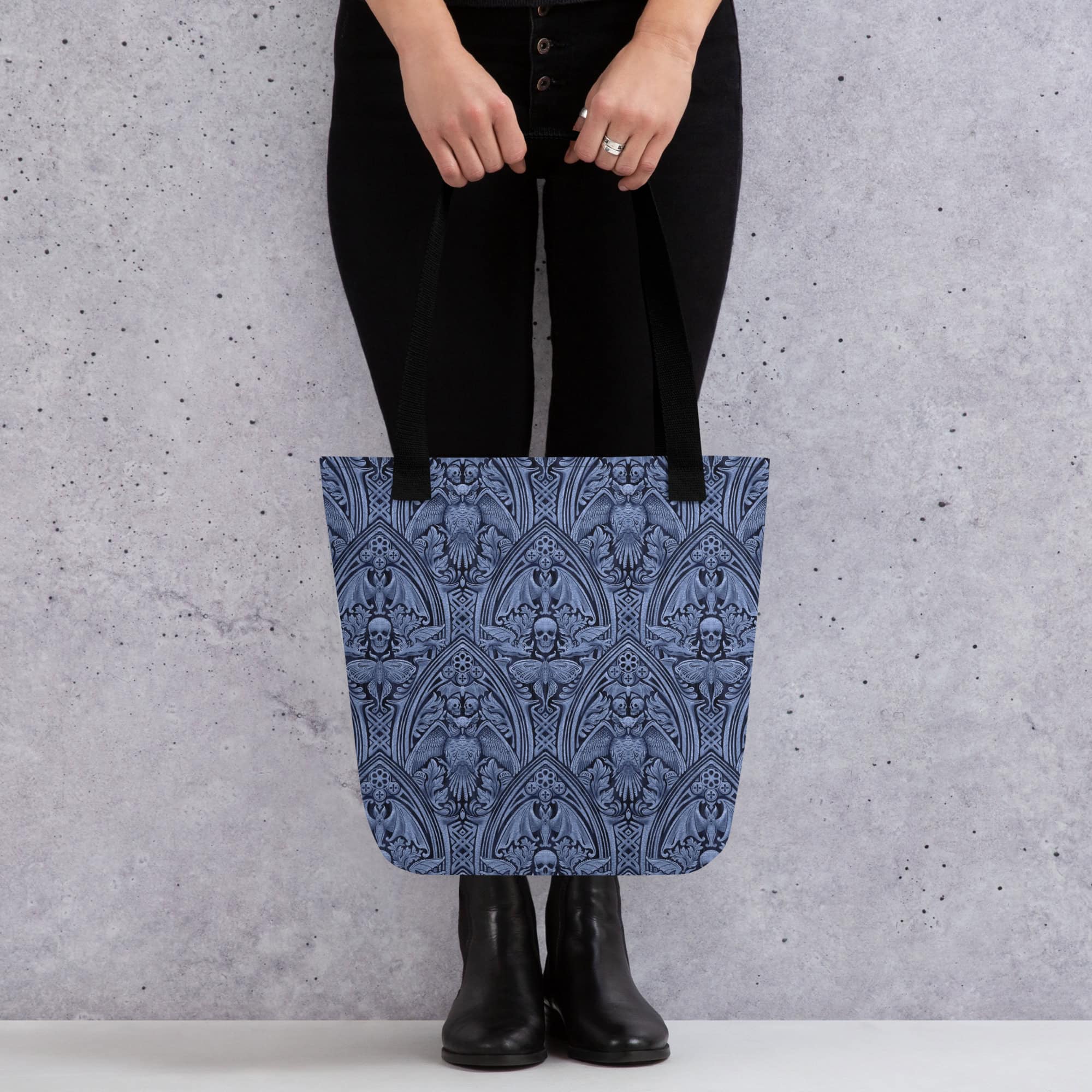 Woman holding The Grande Macabre in Twilight gothic pattern tote bag.