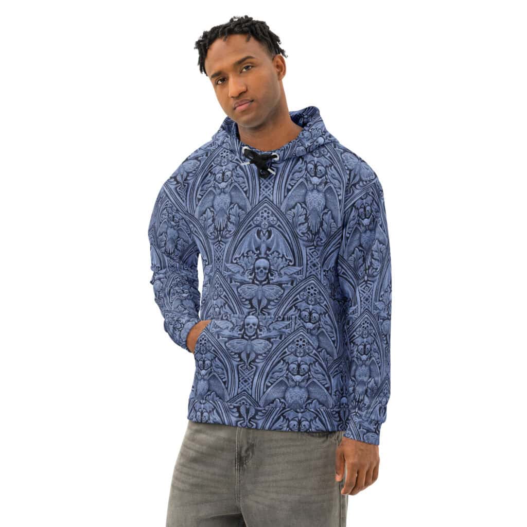 Grande Macabre unisex cotton hoodie in twilight blue, shown from the front on a male model.