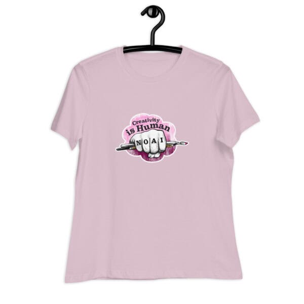 Creativity is Human No AI women's relaxed t-shirt in light violet with hand-drawn fist and paintbrush graphic.