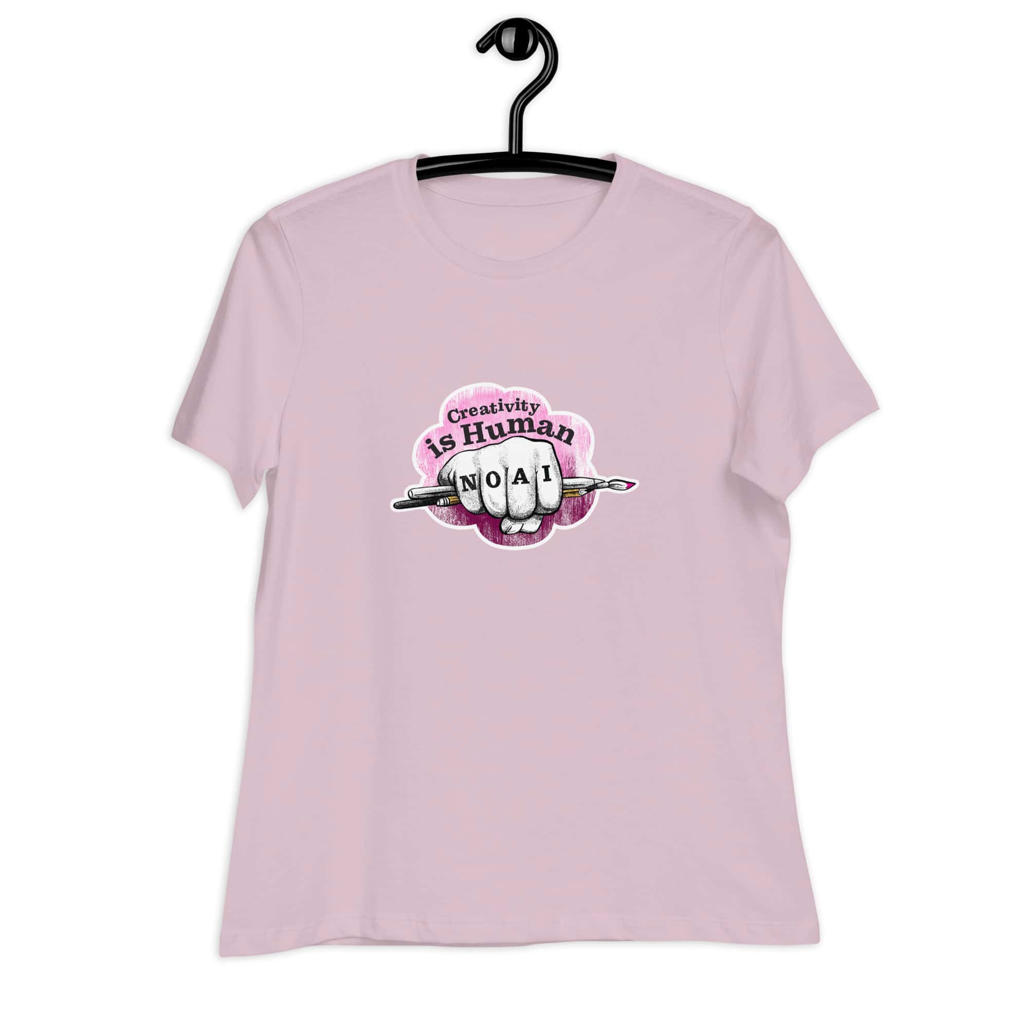 Creativity is Human No AI women's relaxed t-shirt in light violet with hand-drawn fist and paintbrush graphic.