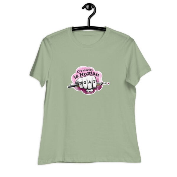 Creativity is Human No AI women's relaxed t-shirt in sage green with hand-drawn fist and paintbrush graphic.