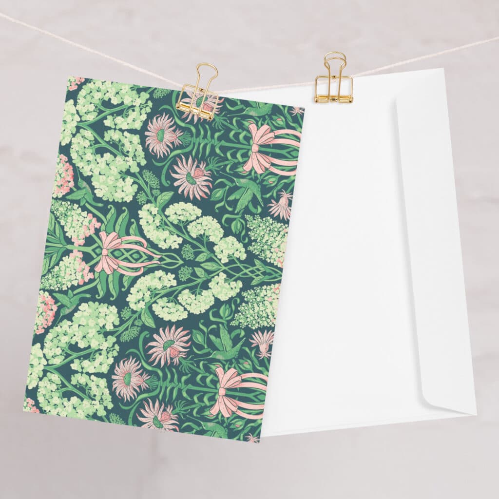 Pretty in Pinky greeting card and envelope clipped to a line.