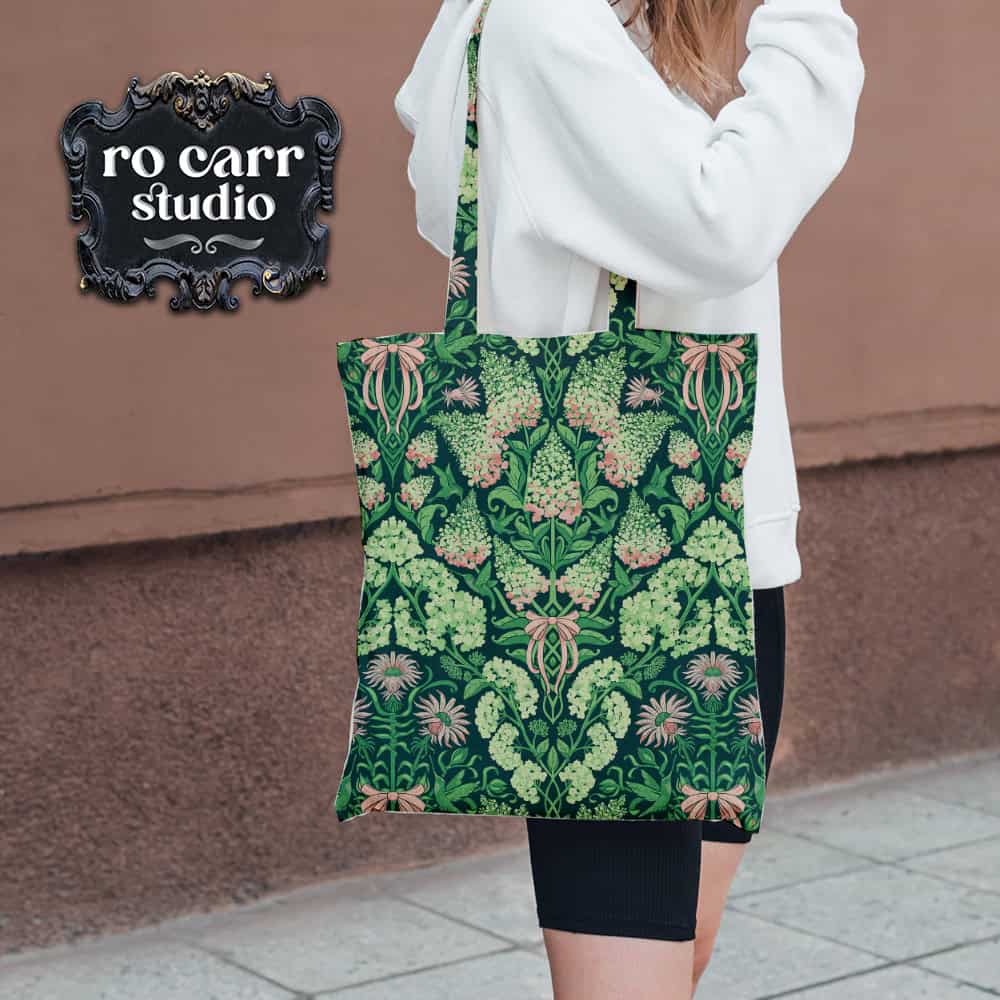 Tote bag in the hydrangea print, carried over a woman's shoulder.