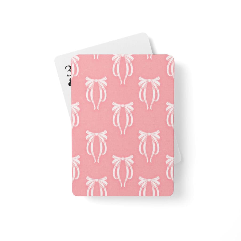 Pretty in Pinky Ribbons deck, pink bow print, with a white-backed card fanned behind it.