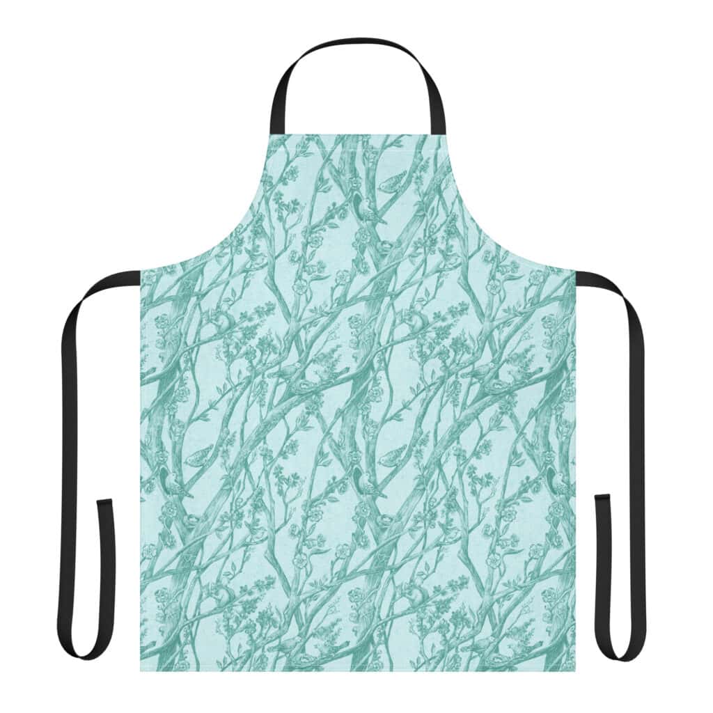Layflat of kitchen apron with black straps, printed with Toile de Vie in aqua.