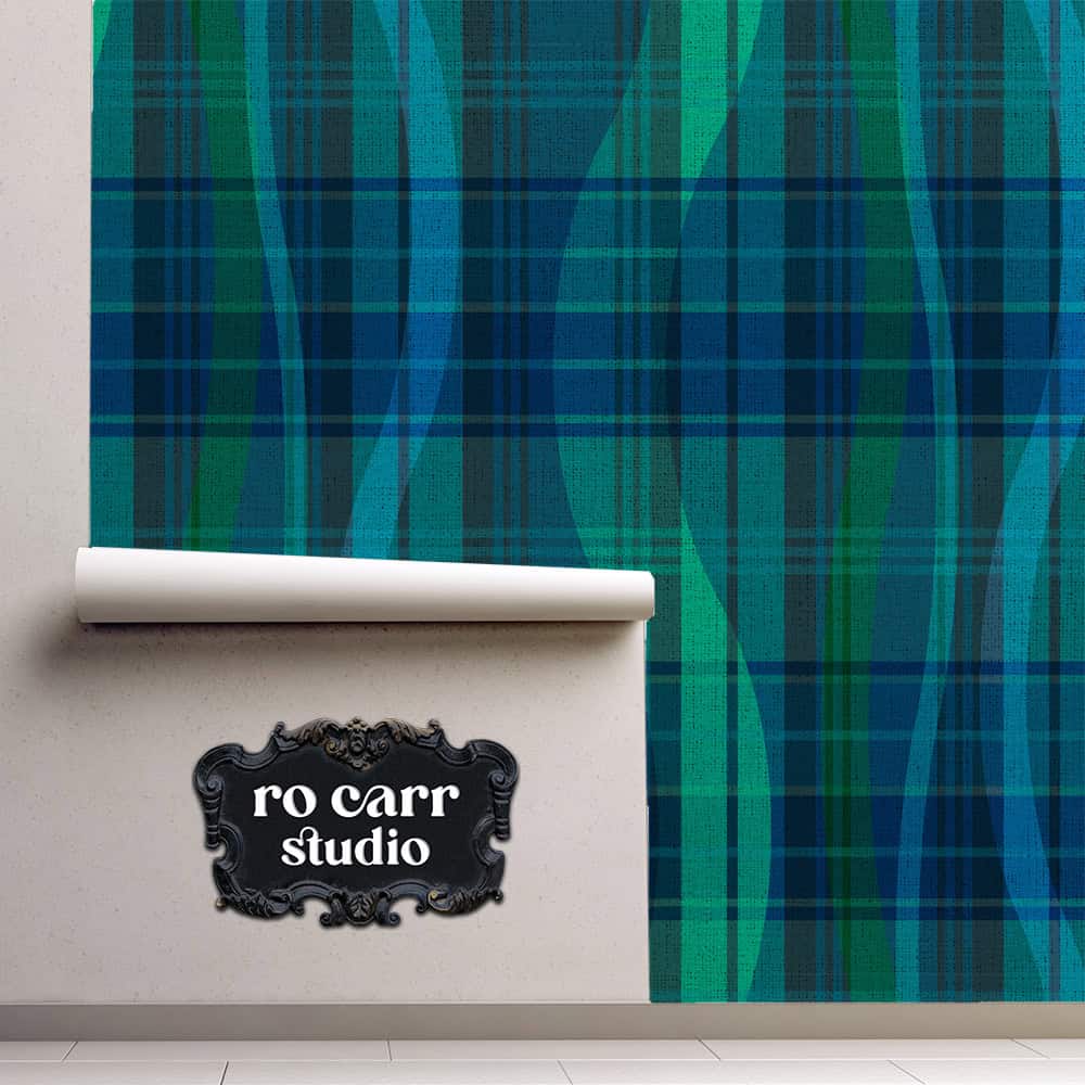Wallpaper roll unrolled against a wall, showing teal and navy Black Watch plaid with wave lines.