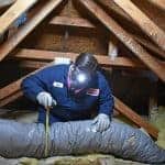 A caring expert inspects attic air ducts with care, ensuring reliable comfort as part of our trusted 13-Step PureFlow Process.