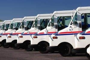 Delivery trucks for direct mail marketing services.