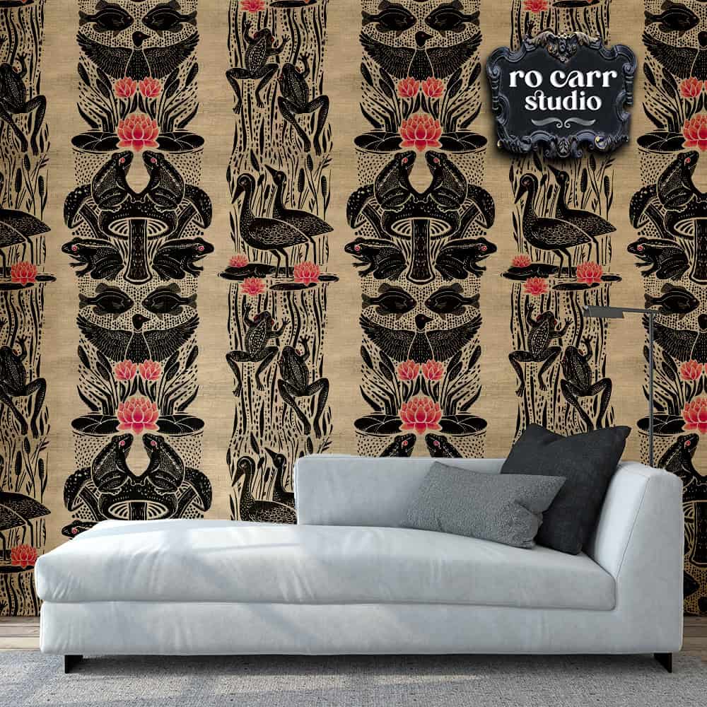 Interior scene with light gray chaise lounge and gray throw pillows against a wall papered with Louisiana Bullfrog Fete design.