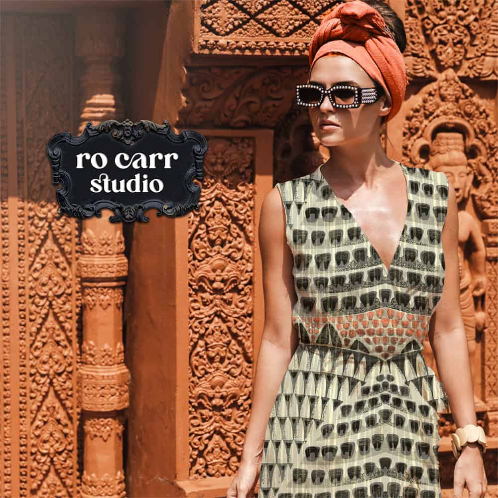 Woman in a turban and sunglasses wearing a sleeveless dress printed with the Armadillo pattern.