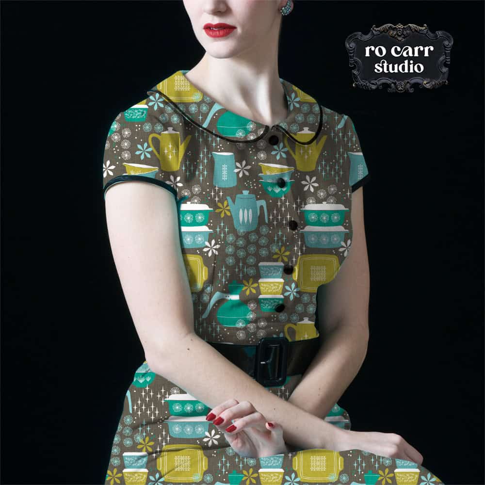 Young woman dressed in a vintage 50s style dress, a mockup using the Hostess with the Mostest pattern.