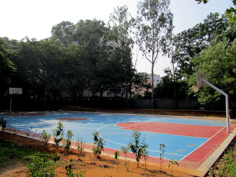 Outdoor basketball court view of Suchitra Academy.