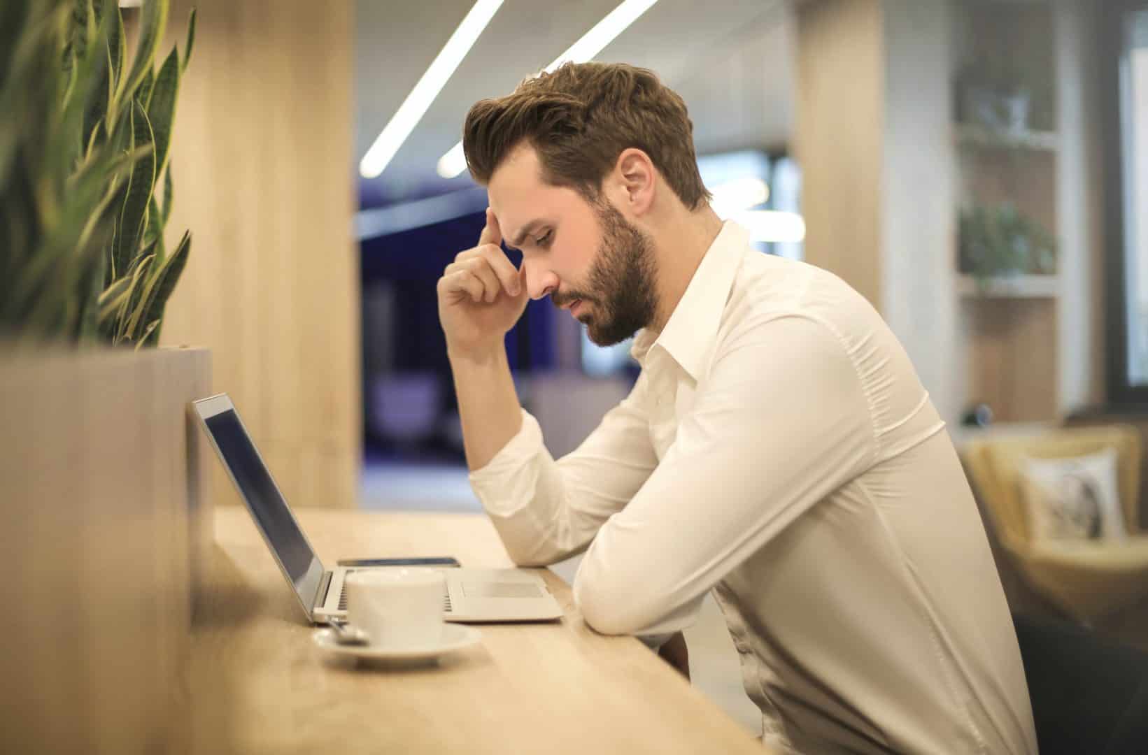 man-looking-down-at-work