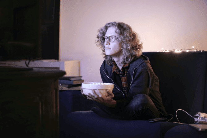 Man-with-geeky-glasses-watching-movie