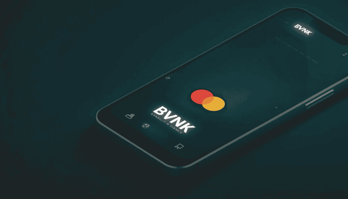 A smartphone illustrating the convergence of traditional finance and blockchain technology, in the context of Mastercard’s acquisition of stablecoin startup BVNK.