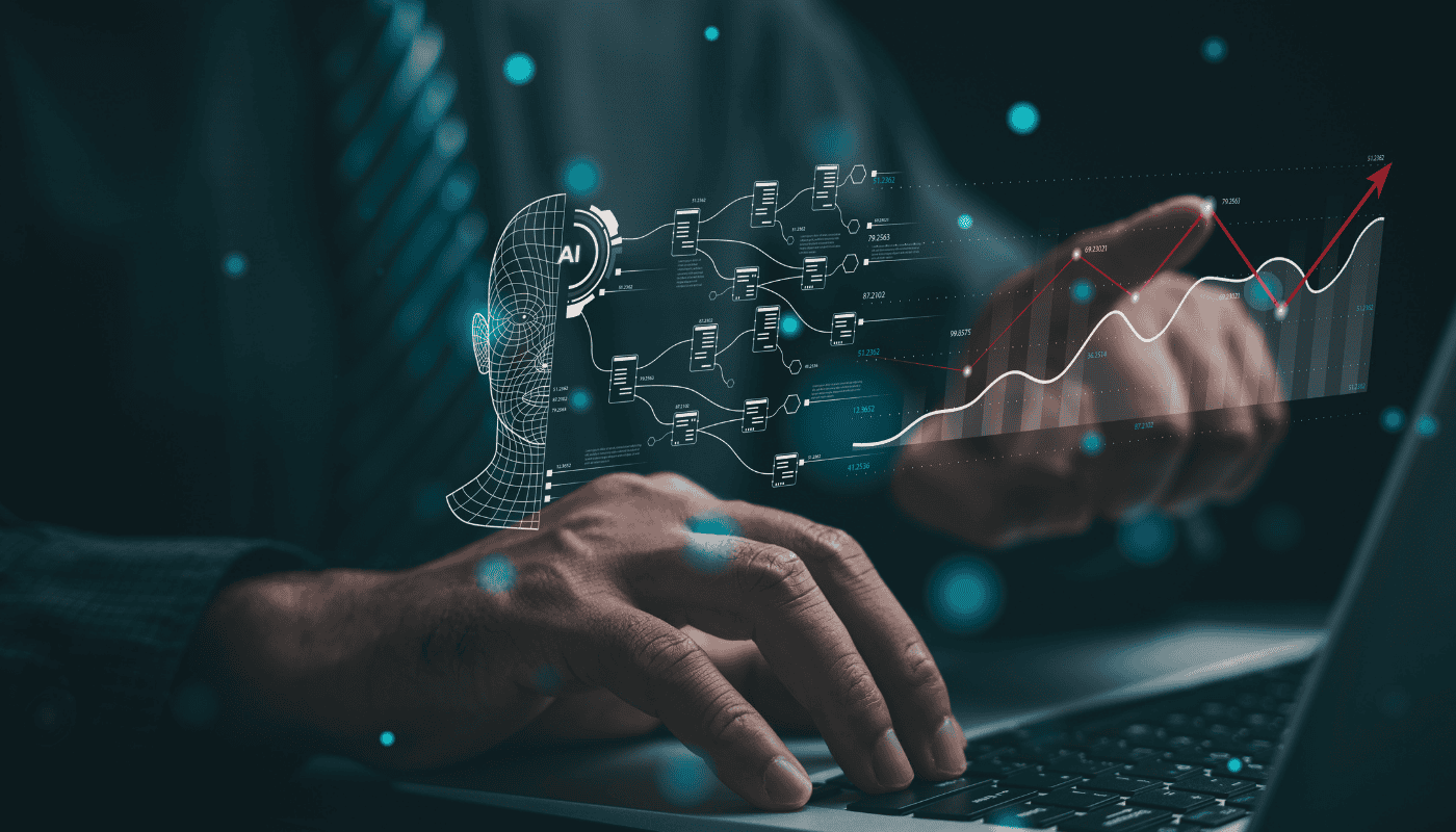 A person using a laptop with financial data on screen, illustrating the growing trend of consumers using AI tools like ChatGPT and Claude for investment guidance.