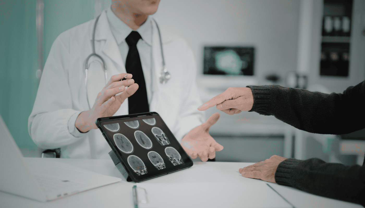 A medical professional examining a scan in a clinical setting, representing the growing role of AI diagnostic tools across NHS trusts and the emerging debate about patient disclosure and consent.