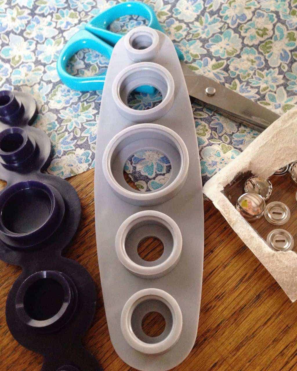 this little tool is perfect for helping you make fabric buttons