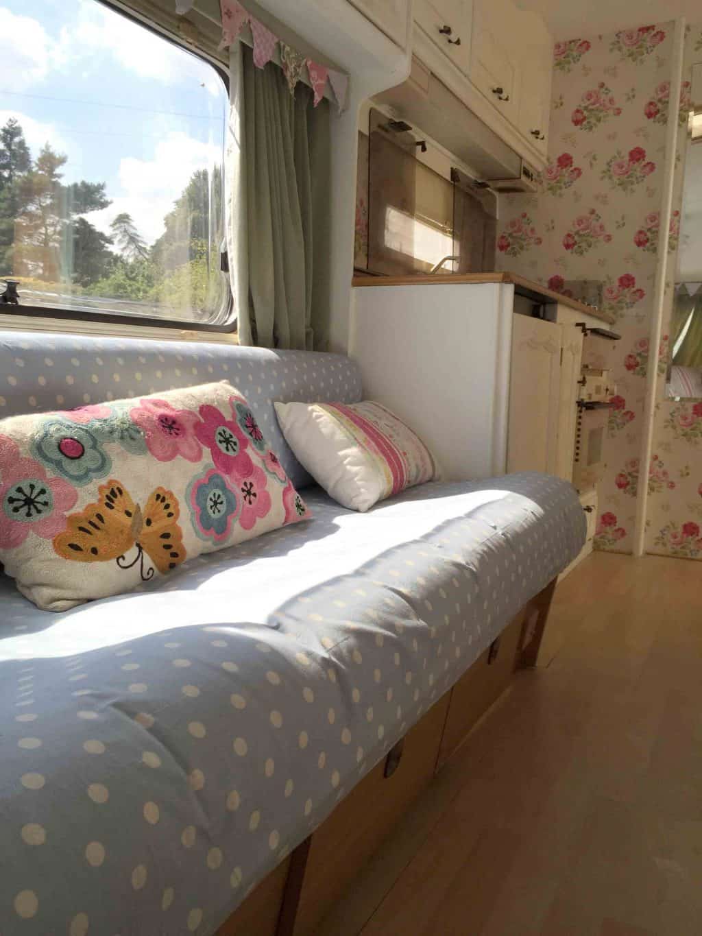 The sun coming through the window of Dolly the caravan. We used laminate on the floor and I covered the cushions with polkadot fabric. She looked so much fresher after her caravan makeover!! More info on both of my caravan makeovers on the blog! 