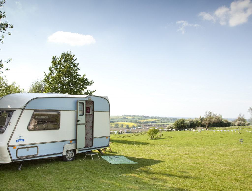 Dolly — our cool caravan — after her caravan makeover!! I painted the exterior of Dolly in fresh white and powder blue — and made a vinyl decal with her name on it!! She looked so much better than when she was boring old beige. She regularly got mistaken for a vintage caravan!
