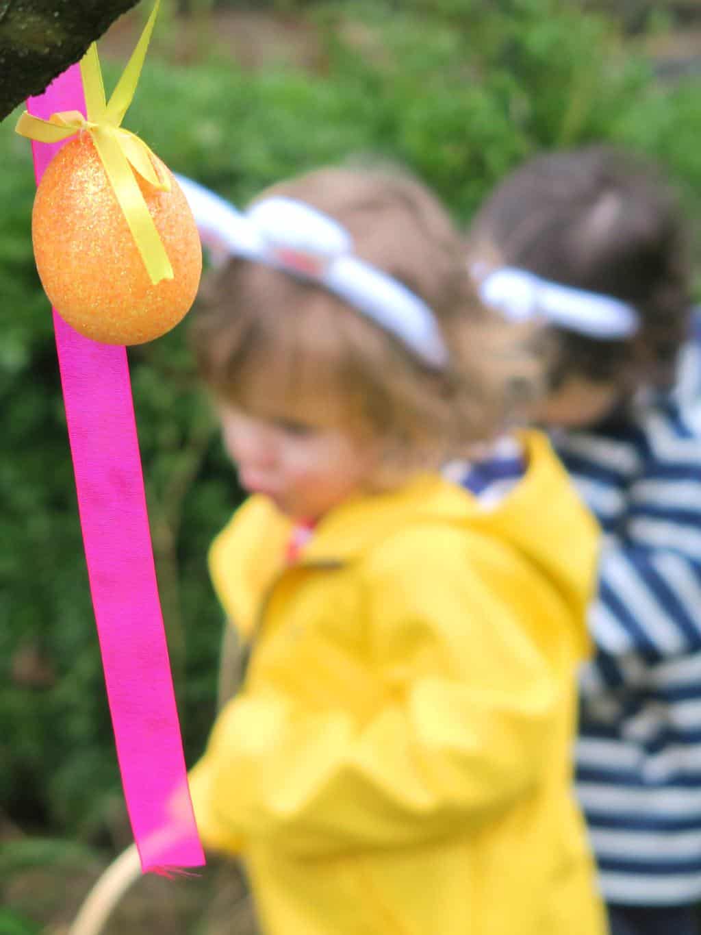 Ribbons and eggs hanging from a tree for an Easter egg hunt