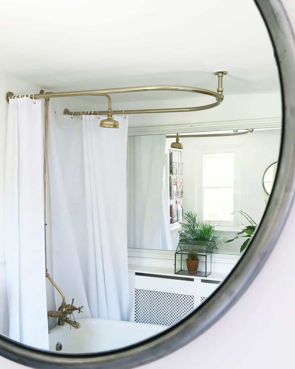 Unique Bathroom Decor Ideas — frame a large mirror.