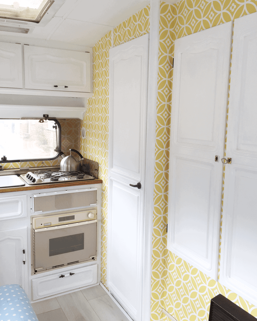 Yellow colour scheme for a small caravan interior.