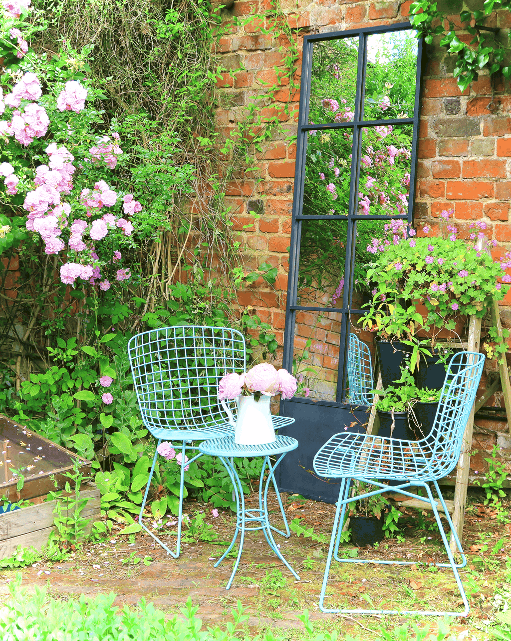 The roses in our walled garden really come into their own during the summer. This sunny spot is decorated with a garden mirror plus an outside seating area to enjoy the view.