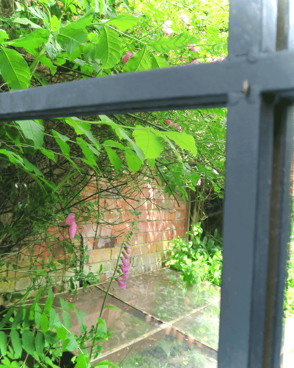 A strategically placed garden mirror will illuminate even the gloomiest corner and also give tantalising glimpses into other areas.