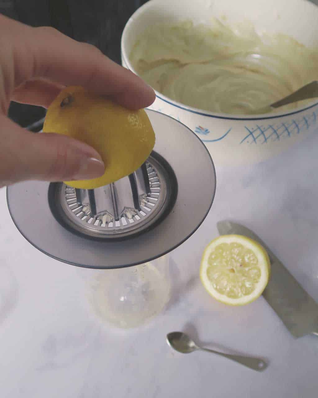 Juicing a lemon for the easy No Bake Malteser Cheesecake