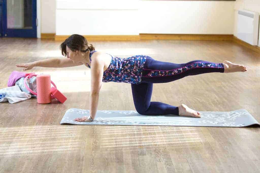 My Favourite 5 Pilates Moves — Pilates Kneeling Superman — Position 3 — Simultaneously, raise your left leg up from the floor — to trunk height — whilst raising the right arm. Hold the pose for a few seconds. Then reverse the action; lower your toe and hand back to the ground, then pull them in towards the body, until you're back in position 1. Repeat up to 10 times — then swap sides.