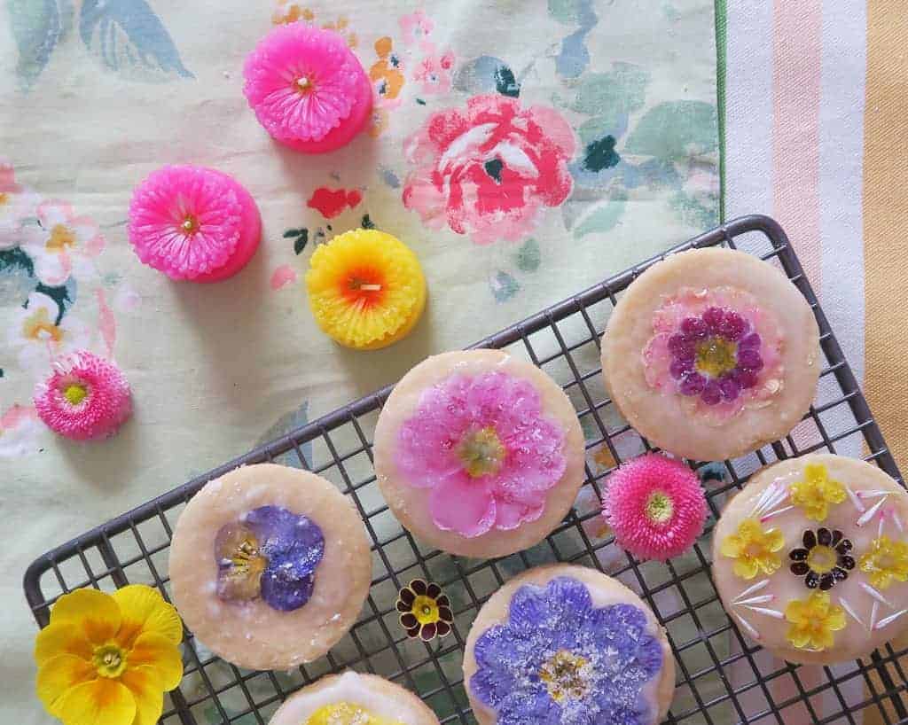 Edible flower biscuits on a wire rack
